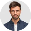 waist-up-portrait-handsome-serious-unshaven-male-keeps-hands-together-dressed-dark-blue-shirt-has-talk-with-interlocutor-st.webp